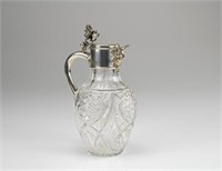 English cut glass claret jug with silver mounts