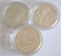 Three NZ cased silver dollars