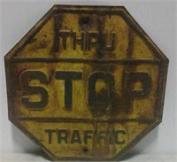 Embossed stop thru traffic sign