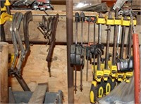 All the clamps on wall: approx 25 bar clamps