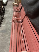 3 red park benches.