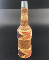 Antique small bottle with beautiful grass weaving,