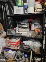 Metal shelf with contents. Empty jars, plastic