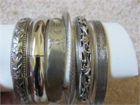 Silver colored bracelets