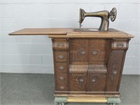 Antique Sewing Machine With Ornate Oak Cabinet