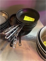 10 assorted size frying pans