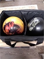 2 bowling balls with rolling case