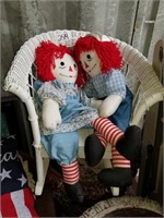 wicker rocker chair & Raggedy Ann dolls