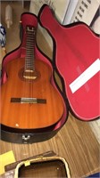 Vintage Yamaha acoustic guitar with case.  Yellow