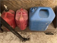 Three plastic gas cans