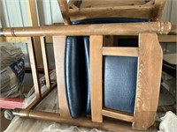 Four wood chairs on rollers
