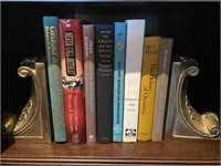 ASSORTED BOOKS WITH GOLD BOOKENDS