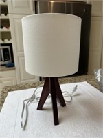 Contemporary table lamp with wood base, 15" tall.