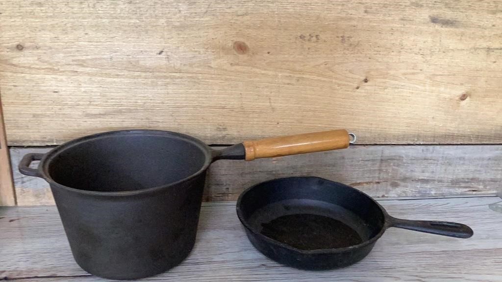 Cast iron and frying pan and pot with wooden