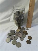Jar full of foreign coins