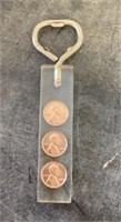 Bottle opener with imbedded pennies