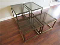 A Suite of Four Contemporary Glass Top Tables