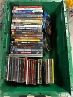 Tote full of dvd movies and cassette tapes