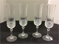 Set of four crystal champagne flutes.  1903