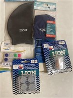 Assortment of Lion and Speedo swim caps, and ear