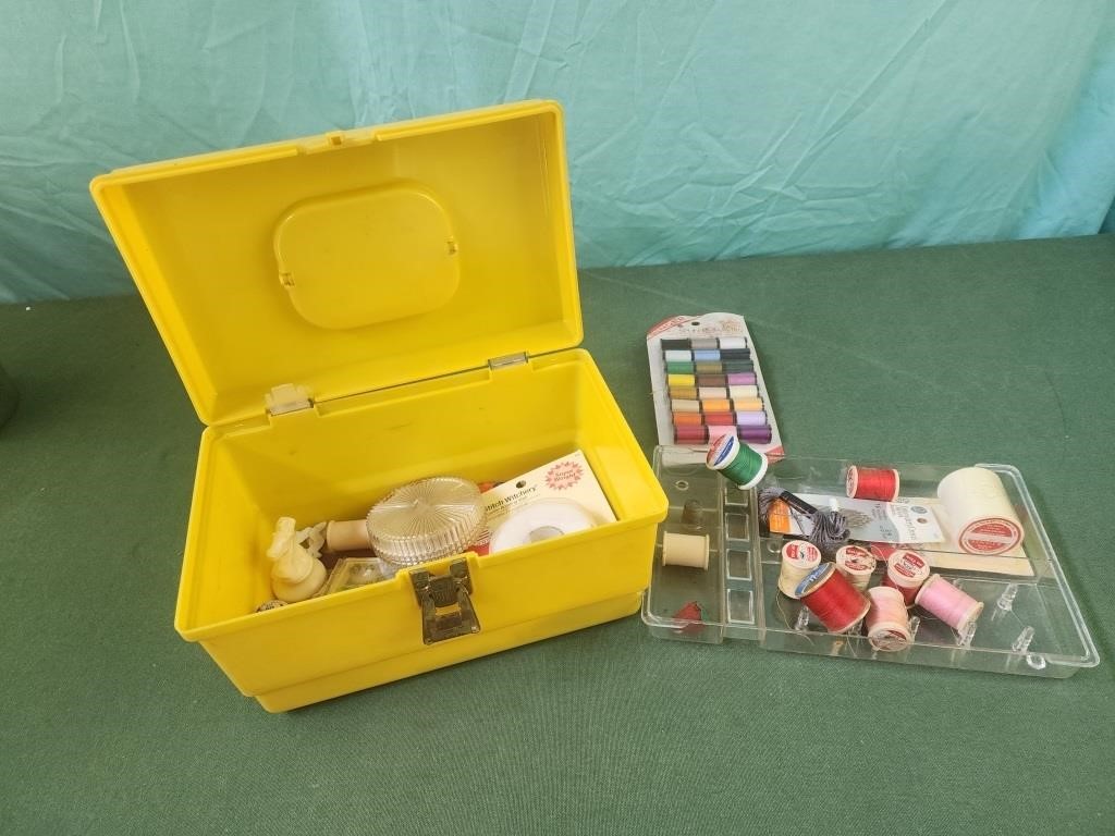 Small plastic box with sewing accessories