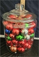 tall storehouse jar with Christmas ornaments as is