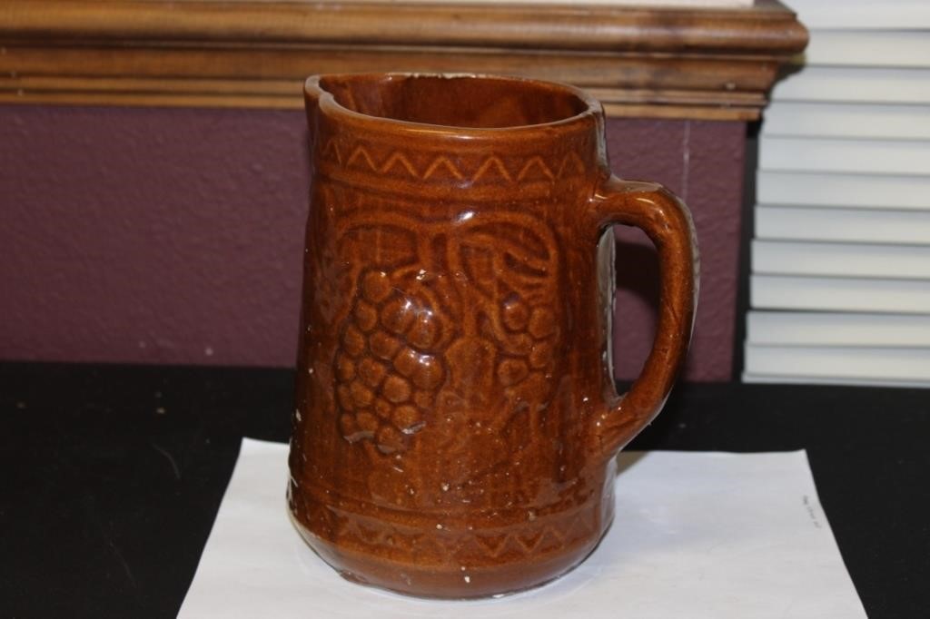 An Antique Majolica Brown Pitcher Pitting