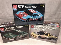 3 Racecars models STP, Quaker State, Country T