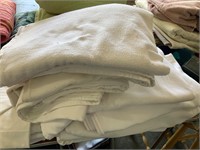 stack of white hospital blankets
