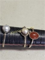 3 sterling rings 2 w/pearls & 1 w/ruby