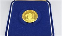 Gold Jamaican $100 coin