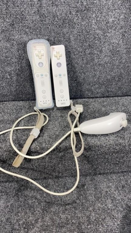 2 Nintendo Wii Remotes and Numchuck