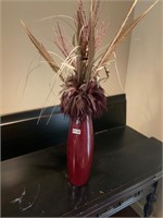 Red vase and flowered decor