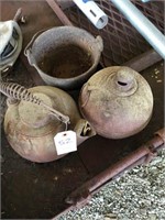 Group of cast iron items (including smudge pot, ke
