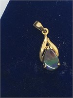 14k gold and ammolite pendant valued at $325