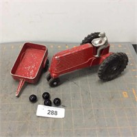 Slik toy tractor and cart