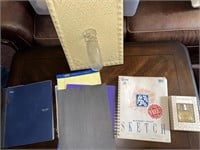 notebooks and wall hanging