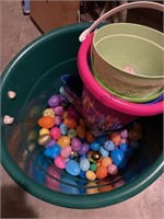 Big green tub with Easter eggs and buckets