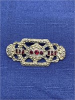 Vintage red stones brooch