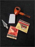 Vintage pipe and matches with vintage 1976 Zippo