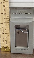 Electric shock lighter. New. Uses 1 AAA battery.