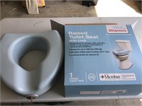 Raised toilet seat new in box