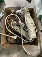 box lot of cords and surge protectors