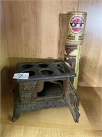 Incomplete small iron stove and vintage Brass