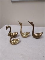 Group of brass swans