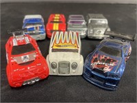 Collection of seven Hot Wheels mini cars.