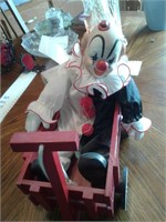 PORCELAIN CLOWN DOLL IN WAGON