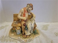 Old man sewing ceramic figure 6.5"L note chips