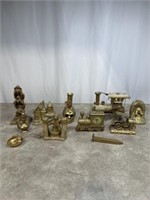 Assortment of gold painted trains, cars, and home