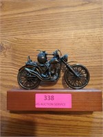 Bug driving motorcycle figurine